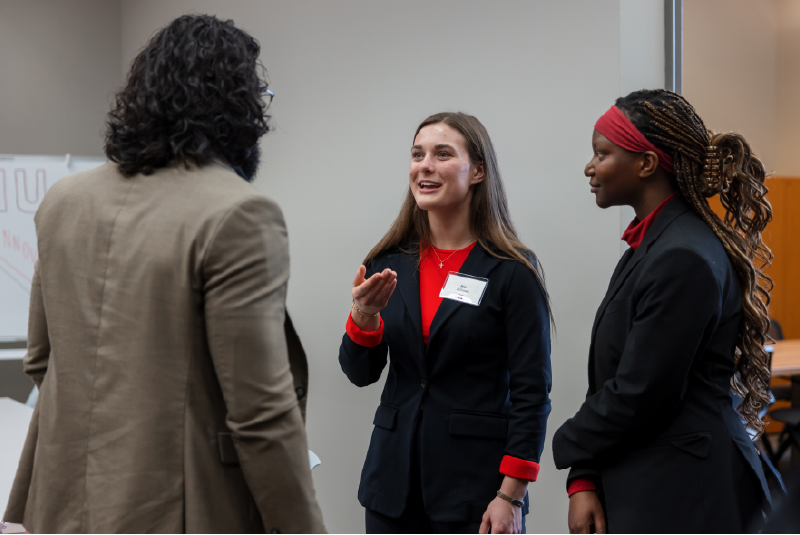 three students talking.