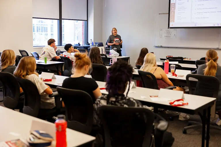 Students doing icebreakers in a classroom
