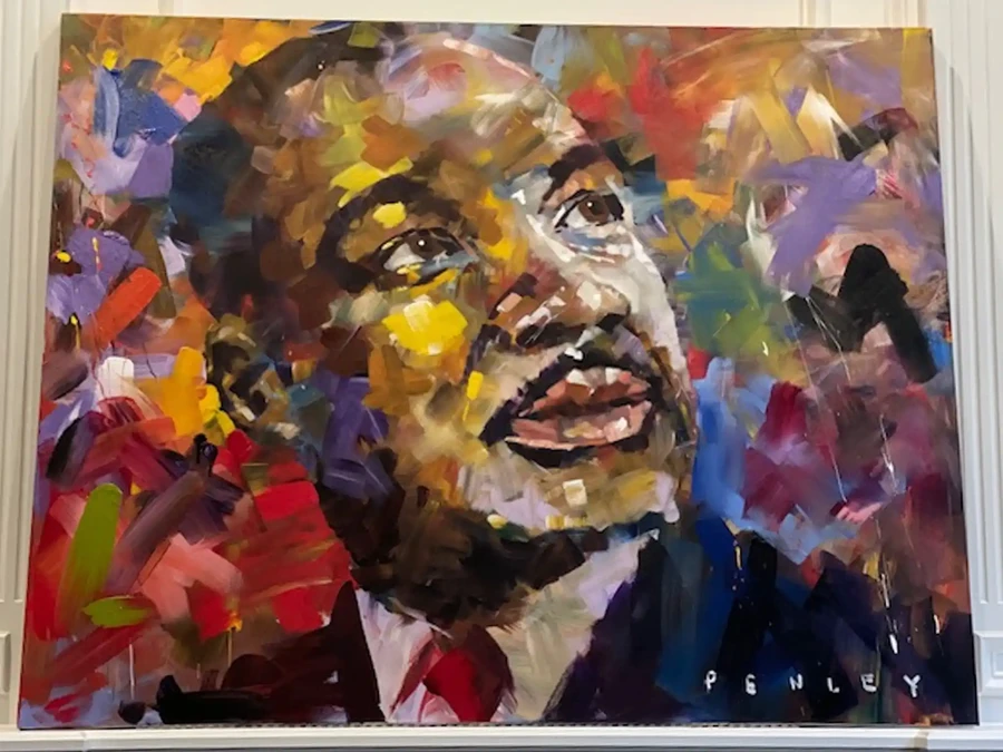 Illustration of a fox standing in snow outside a blue house with a lit window and swirling clouds above.