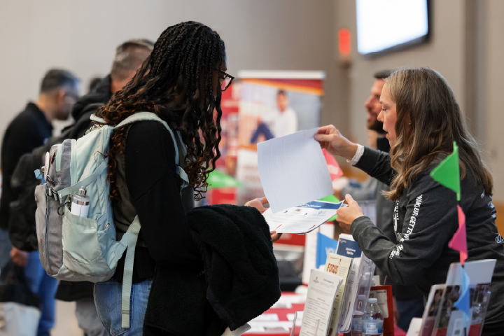 Student talking to a partner about internships.