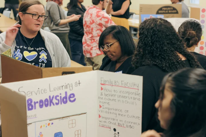 A group of people engaging with presentations at a local Indianapolis community center.