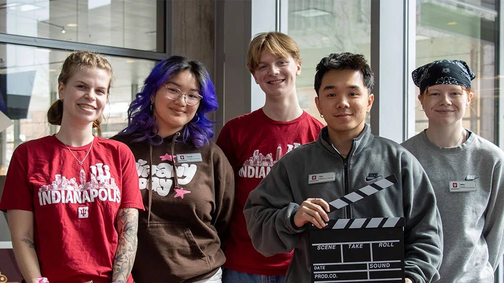 Five student employees smiling