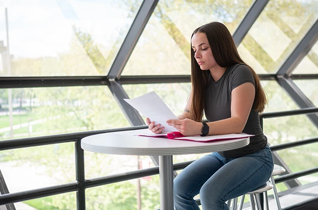 Student looking at papers